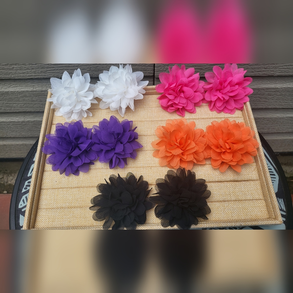 Fabric flower clips in assorted vibrant colors; sold separately. Two of the same